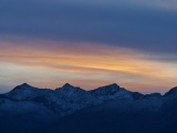 Sunset Streaks over Twilight Peaks