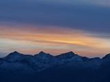 Sunset Streaks over Twilight Peaks