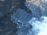 Melting Ice over Stream