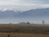Houses in a Misty Valley