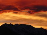 Orange Clouds over Jagged Peaks