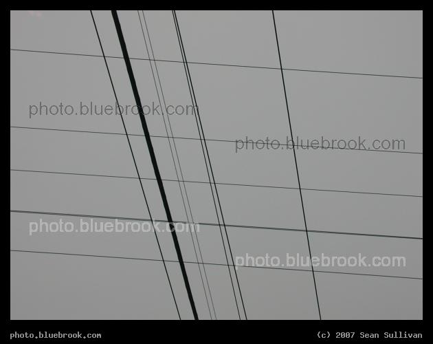 Parallelogram Wires - Crossing wires forming parallelograms against the sky, Shirley MA