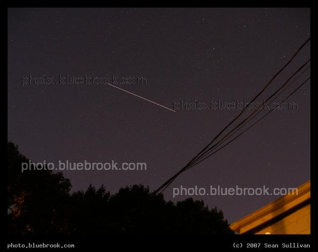 Hatches Closed - Space Station and Shuttle Endeavour (STS-118), hatches closed and 11 hours before undocking, travel together over Arlington MA