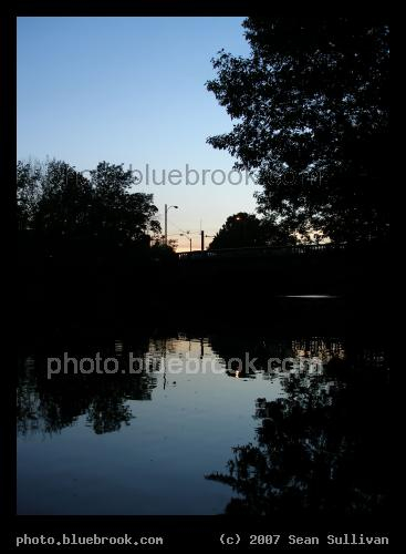 Watertown Reflection - The Charles River in downtown Watertown MA, shortly after sunset, with the Galen Street bridge in the background
