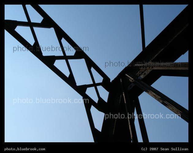Intersecting Supports - Silhouette of metal support elements for a pedestrian bridge crossing the Connecticut River near Northampton, MA