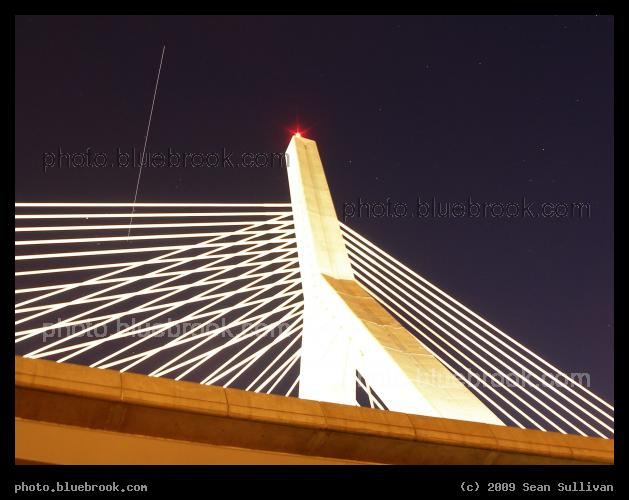 Satellite over the Zakim Bridge - In this 15-second exposure, the docked International Space Station and Space Shuttle Discovery (flight STS-119) rise over the Zakim Bridge (Interstate 93), Boston MA