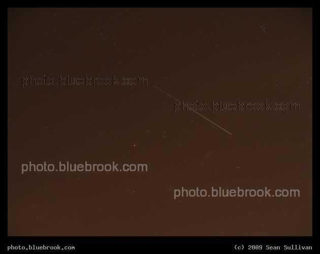 Sunrise in Auriga - During this 15-second exposure from Somerville MA, the docked International Space Station and Space Shuttle Discovery (STS-128) emerged from the Earth