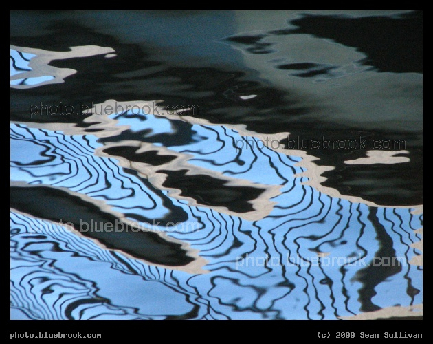Lines on the Water - A reflection of a pedestrian bridge at North Point Park in an inlet from the Charles River, Cambridge MA