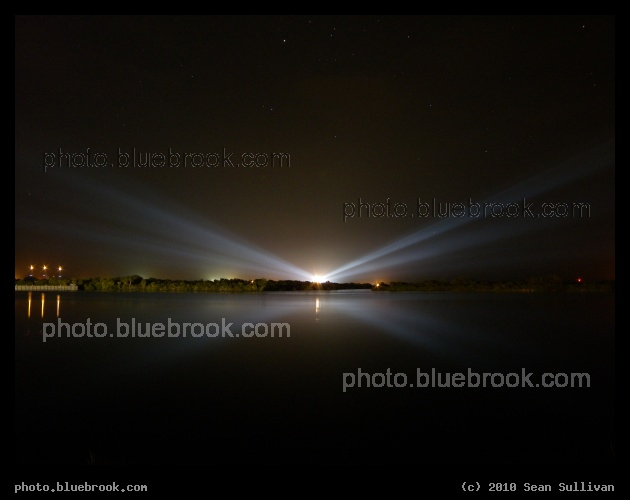 Discovery under Auriga - Space shuttle Discovery (STS-133) illuminated by floodlights at Kennedy Space Center launch pad 39-A, under the constellation Auriga, as seen from the NASA/KSC press site