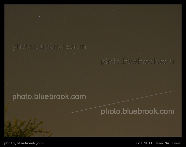 Through the Big Dipper - In this 30-second time exposure, the docked International Space Station and space shuttle Discovery (flight STS-131) pass over Somerville MA.  The line is due to the station/shuttle moving (left to right) during the exposure.