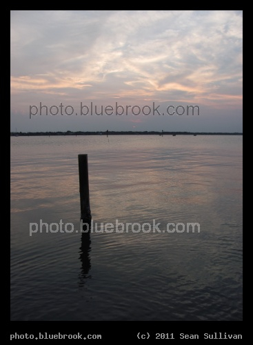Indian River Sunset - Looking over the Indian River with the setting sun faintly visible near the horizon, Merritt Island FL
