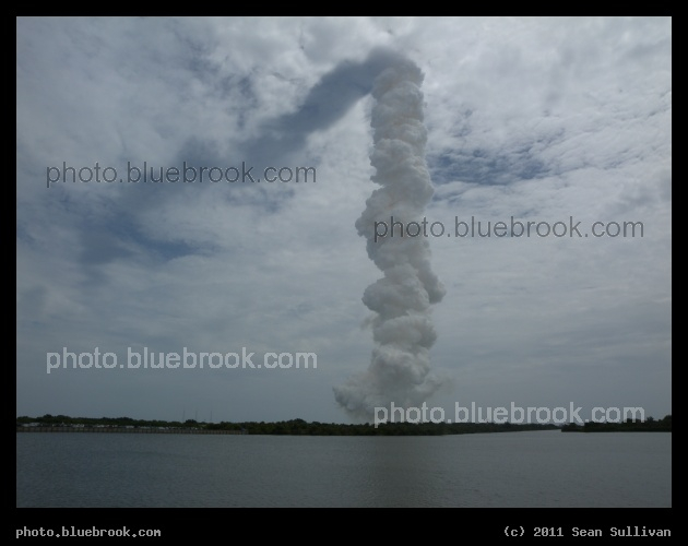 Shadow on the Clouds - The shadow of space shuttle Atlantis