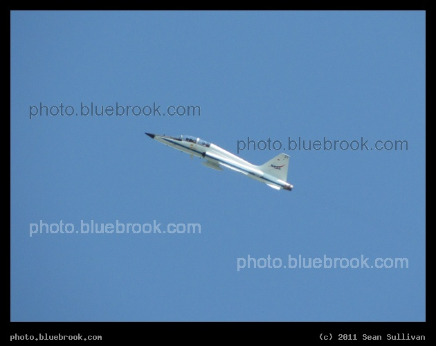 Circling Endeavour - A NASA T-38 airplane, a type often used by the astronauts, flying loops over launch pad 39-A at the Kennedy Space Center on the afternoon before the final launch of space shuttle Endeavour (STS-134)