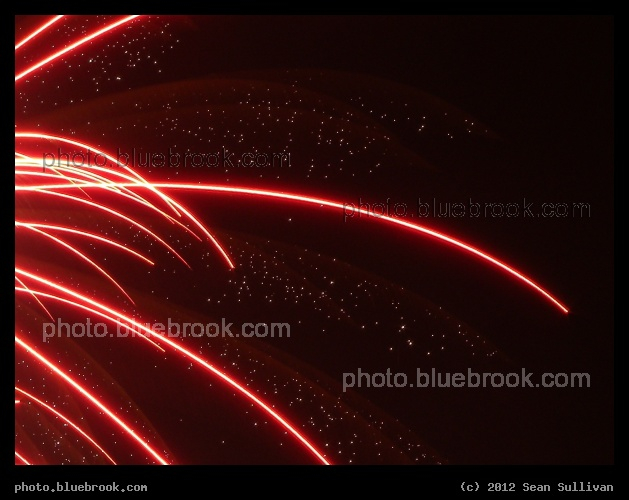Sparkles and Red Streaks - First Night 2011 fireworks over Boston Harbor
