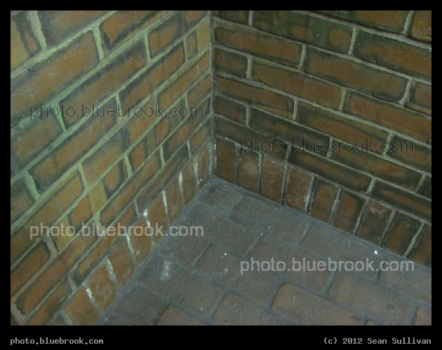 Brick Corner - At the Holland St entrance to the Davis Square MBTA subway station, near the top of the escalator.  Somerville, MA