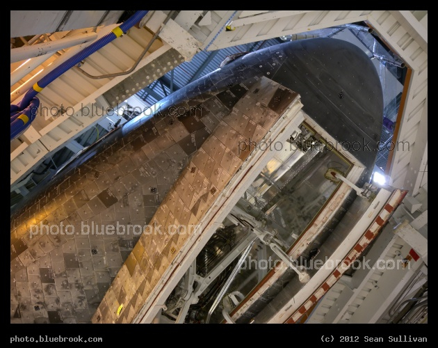 Under the Nose - Looking up at the nose and forward landing gear doors of space shuttle Discovery.  Orbiter Processing Facility, Kennedy Space Center, Cape Canaveral FL