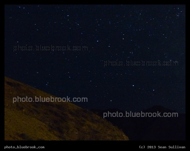 Sagittarius Rising - The eastern portion of Sagittarius rising above mountains from Riggins ID.  Nunki is the bright star in lower-right, with the globular cluster M-22 on far right.