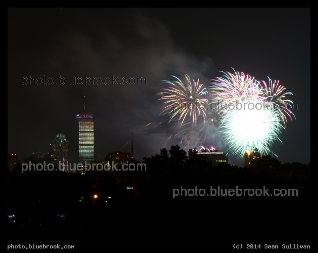 Reflecting Tower - 2014 Boston fireworks reflected in the Prudential Tower, viewed from MacDonald Park, Mystic River Reservation, Medford MA
