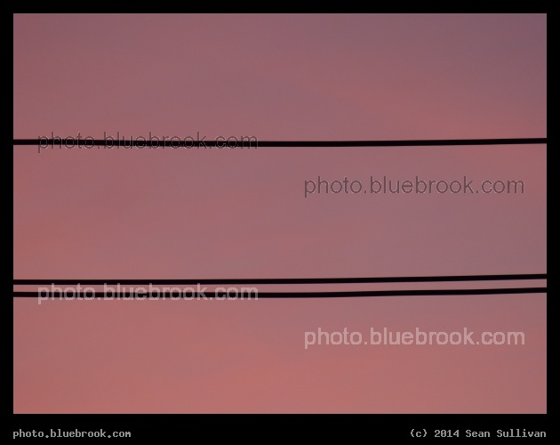 One Line, Two Lines - Silhouette of utility wires against a sunset sky, Somerville MA