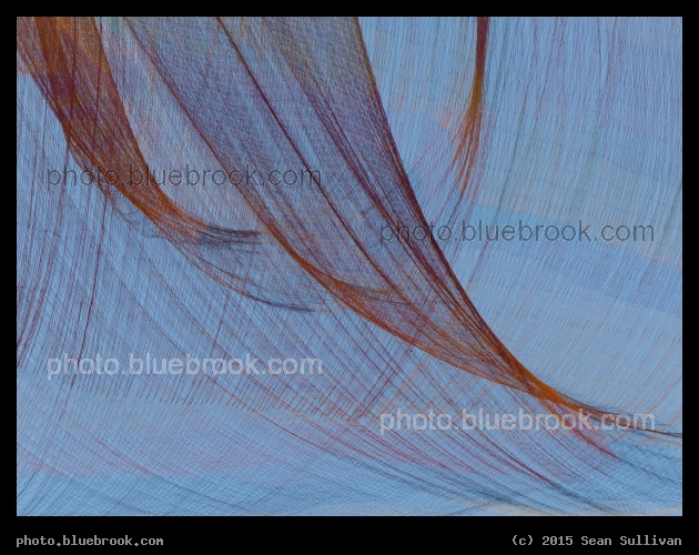 Strings in the Sky - A view of an outdoor art exhibit by Janet Echelman over the Greenway, Boston MA