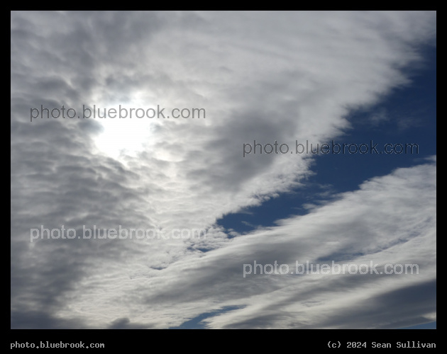 Sun behind White Clouds - Corvallis MT
