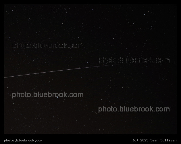 Sunset in Space - Time exposure of the International Space Station moving (left to right) into the Earth